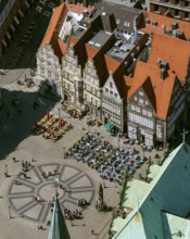 Hanseatic cross in front of the Bremen Roland on the market square of Bremen in front of the town
