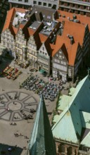 Hanseatic cross in front of the Bremen Roland on the market square of Bremen in front of the town