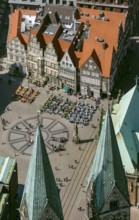 Hanseatic cross in front of the Bremen Roland on the market square of Bremen in front of the town