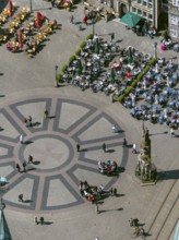 Hanseatic cross in front of the Bremen Roland on the market square of Bremen in front of the town