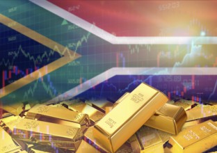 Gold bars on South Africa flag in background. Gold bars stacked on South African flag. Concept of