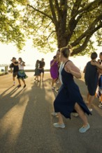 People dancing in the sun, Promenade, Bregenz, Lake Constance, Vorarlberg, Austria