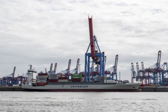 Container ship, loading cranes and stacks of containers, Port of Hamburg, container terminal,