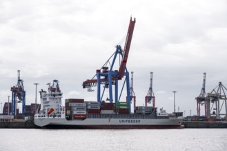 Container ship, loading cranes and stacks of containers, Port of Hamburg, container terminal,