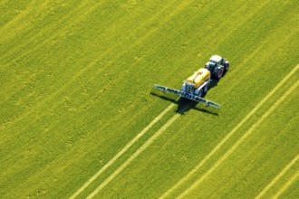 Aerial view, tractor with trailer working in the field, fertilising, Hellefeld, Sundern, Sauerland,