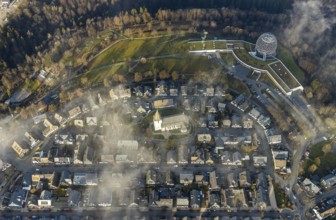 Aerial view, Winterberg centre, Catholic church looking out of the clouds, Oversum Vital Resort,