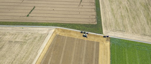 Aerial view, harvesting vehicles with straw bales in Ruploh, grain harvest, fields, Soest, Soester