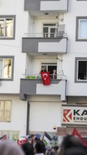Gaziantep, Türkiye – October 11, 2025: People watch and show support from their balconies as