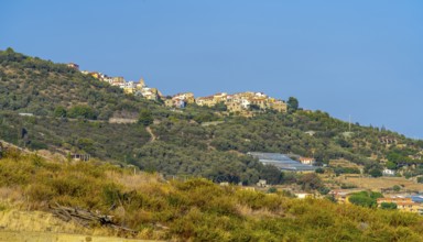 Small village on hill top seen in Liguria, Italy