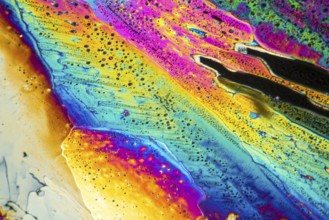Colorful microscopic shot of Sodium acetate micro crystals in polarized light
