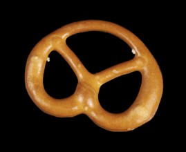 Closeup of a lye pretzel in dark back