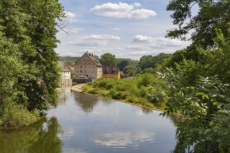 Riparian impression of Berlichingen at river Jagst in southern Germany at summer time
