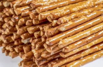 Closeup of some stacked salt sticks in light back