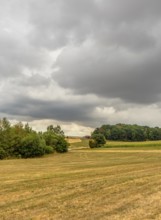 Stormy farmland scenery in Hohenlohe, an area in Southern Germany at late summer time