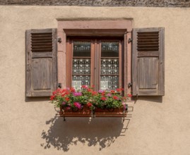 Sunny illuminated window seen in Kaysersberg, a historical town and former commune in Alsace in
