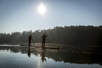 DEU Germany Germany Berlin Standup paddler (SUP) on the Krumme Lanke