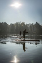 DEU Germany Germany Berlin Standup paddler (SUP) on the Krumme Lanke