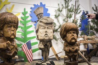 DEU Germany Germany Berlin The busts of U.S. President Donald Trump and Chancellor Angelika Merkel,