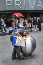 DEU Germany Germany Berlin A deposit bottle collector in front of the Primark store on