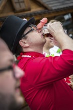 DEU Germany Germany Berlin Groom drinks with penis nose during a bachelor party on Alexanderplatz