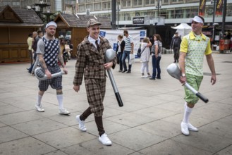 DEU Germany Germany Berlin A group of men in historical golf costumes on Alexanderplatz