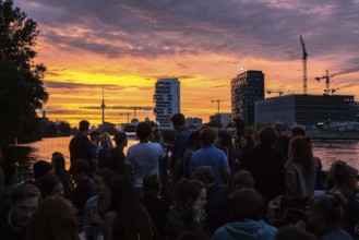 DEU Germany Germany Berlin Sunset on the terrace of the Fluxbau with the Oberbaum Bridge in the