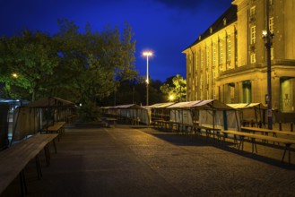 DEU Germany Germany Berlin The flea market stalls in front of Schöneberg Town Hall in the evening