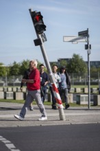 DEU Germany Germany Berlin Pedestrians pass a traffic light on Scheidemannstraße in Mitte