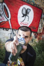 Germany Germany DEU Berlin Graffiti artist Ibo Omari in front of one of his works on a playground