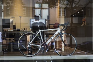 DEU Germany Germany Berlin Bicycle in an office window in Konstanzer Straße