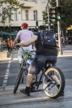DEU Germany Germany Berlin Cyclist crossing a pedestrian crossing in West Berlin at the corner of