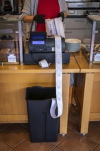 DEU Germany Germany Berlin The receipts in a bakery in Schöneberg are received by a rubbish bin