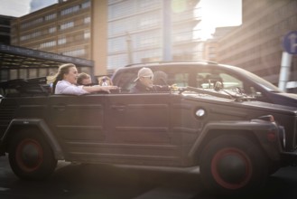 DEU Germany Germany Berlin Young people celebrating in a VW Kübelwagen on Potsdamer Platz
