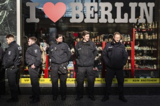 DEU Germany Germany Berlin Police officers stand in front of a souvenir shop at Alexanderplatz