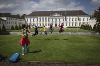 DEU Germany Germany Berlin Tourists pose for a photo in front of Bellevue Palace, the seat of the