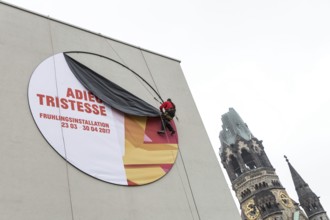 DEU Germany Germany Berlin A worker removes the outdoor advertising for a spring installation in