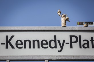 DEU Germany Germany Berlin A freedom statue made of cork stands on the street sign on J.F