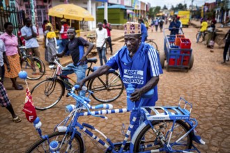 RWA RWANDA Rwanda Kayonza A cyclist with a decorated bicycle poses for a photo