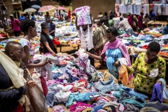 RWA RWANDA Rwanda Kayonza Textiles, fabrics and second-hand clothes are offered at a market