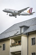 DEU Germany Germany Berlin Landing approach of a German Wings aircraft over residential buildings