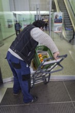DEU Germany Germany Berlin A courier with food orders enters the European Centre
