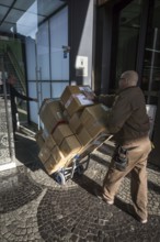 DEU Germany Germany Berlin A parcel courier on Kurfürstendamm