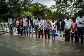 RWA RWANDA RUANDA Kigali A youth group stands in front of a mass grave at the genocide memorial