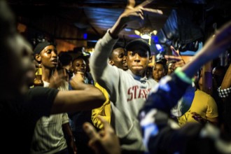 RWA RWANDA RUANDA Kigali Guests at a regular party organised by the Inema Gallery. Artists, locals