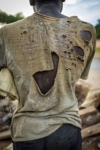 RWA RWANDA RUANDA Kigali A worker with a torn shirt on a construction site