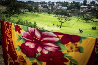 RWA RWANDA RUANDA Kigali Rwandans play on a centrally located golf course at lunchtime. The ceiling