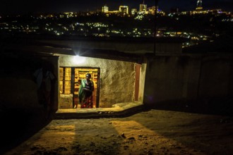 RWA RWANDA RUANDA Kigali Illuminated houses in a poor neighbourhood. The Kiyovu banking district in