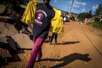 RWA RWANDA RUANDA Kigali A man wearing a shirt on a street in Gikondo district