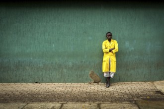 RWA RWANDA RUANDA Kigali A worker pauses against a wall in the Kiyovu banking district