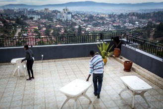 RWA RWANDA RUANDA Kigali workers on the terrace of the Panorama Bar Ivy